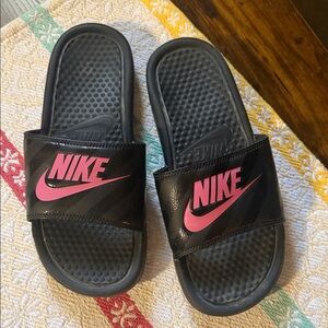 Sorry , no longer available. Nike Black Slide Sandals with Pink Swoosh